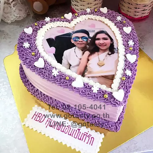 Purple cream photo cake with snow and heart decorations