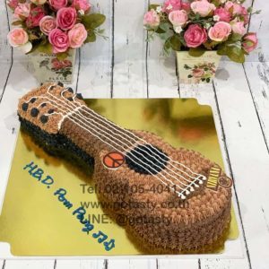 Brown guitar cream cake