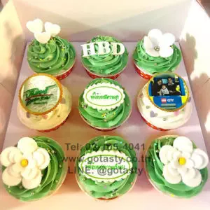 Green photo cupcake with flower and heart decorations