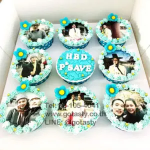 Blue photo cupcake with flower decorations