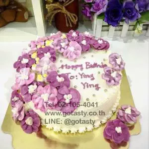 Purple flower cream birthday cake